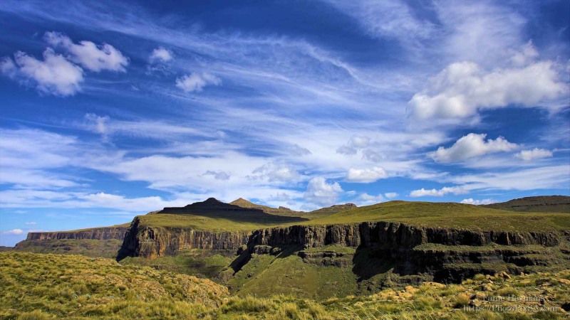 Drakensberg Mountains Lesotho Landscape with beutiful blue clouds and green