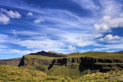 Drakensberg Mountains Lesotho Landscape with beutiful blue clouds and green